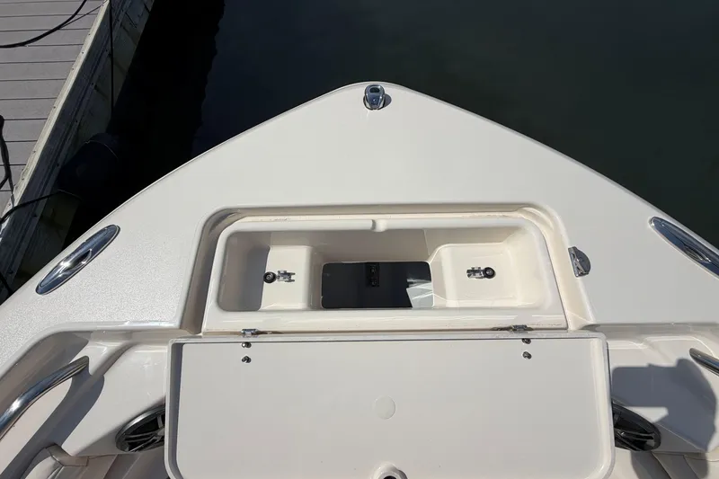 Slide: The Image of Bow storage compartment on 2026 Grady-White Fisherman 216 boat at dock. - 3