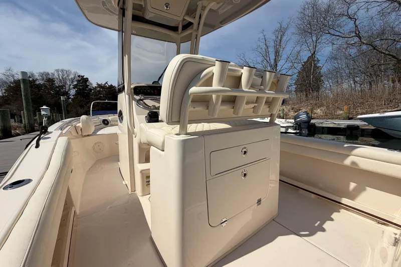 Slide: The Image of 2026 Grady-White Fisherman 216 boat interior with rod holders and storage compartments. - 6