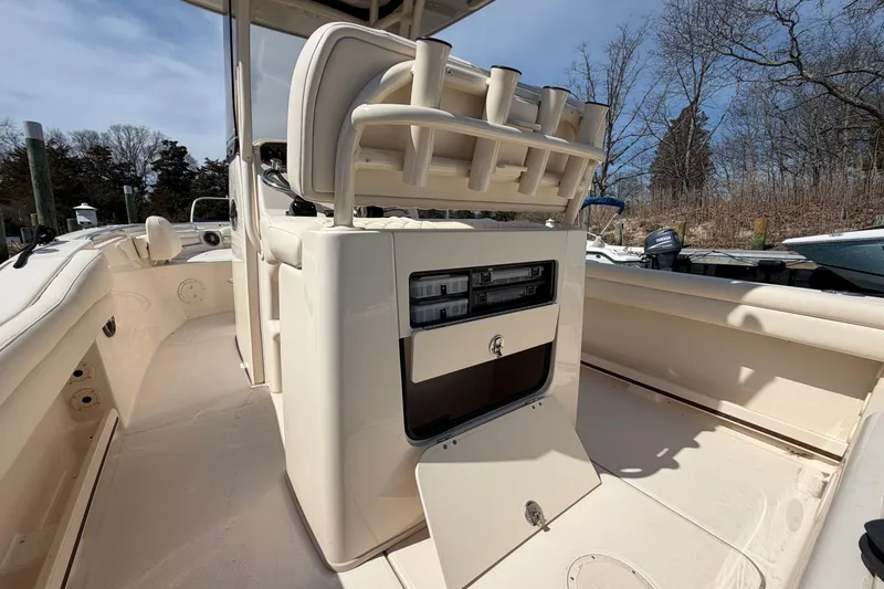 Slide: The Image of 2026 Grady-White Fisherman 216 boat interior with rod holders and storage compartments. - 7