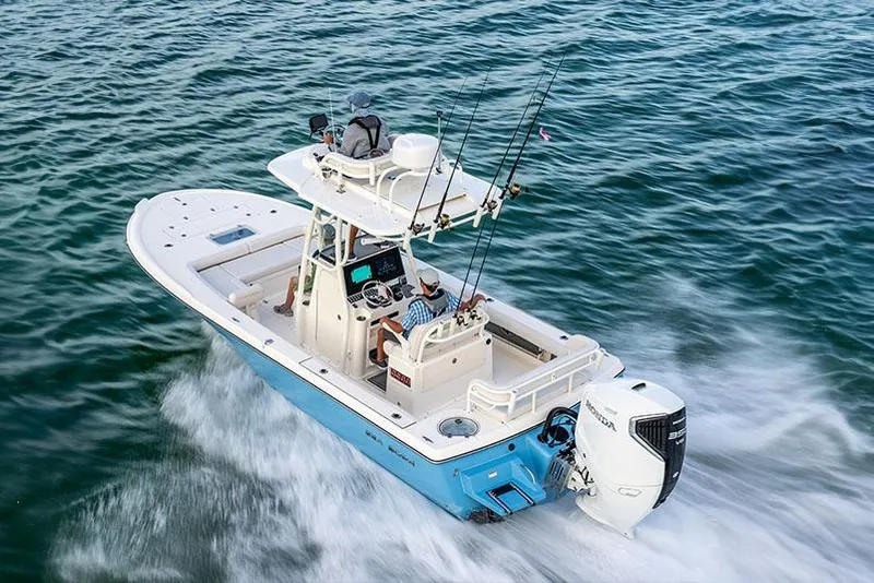 Slide: The Image of Manufacturer Provided Image: 2025 Sea Born FX25 Bay boat cruising on open water, equipped for fishing. - 2