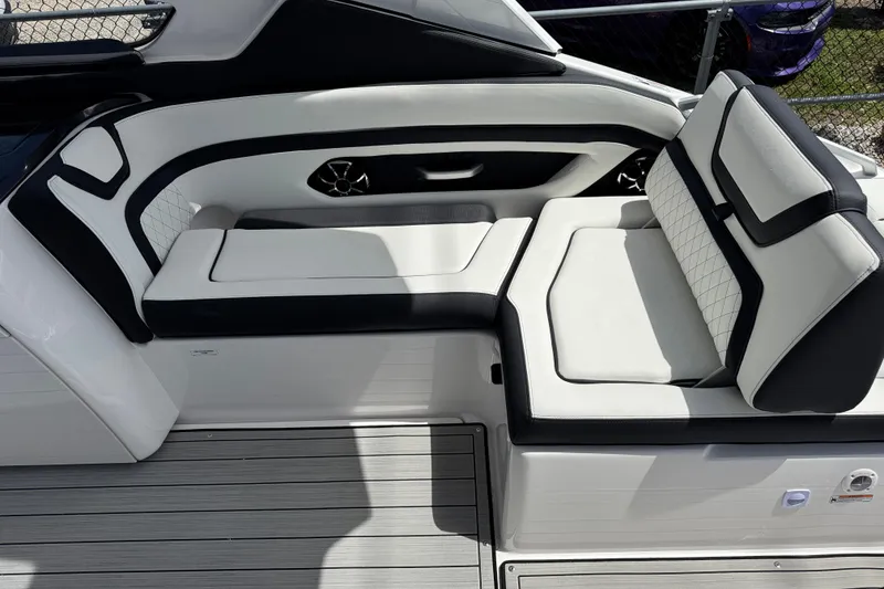 Slide: The Image of 2026 Yamaha Boats 275SD interior seating with sleek black and white design. - 10
