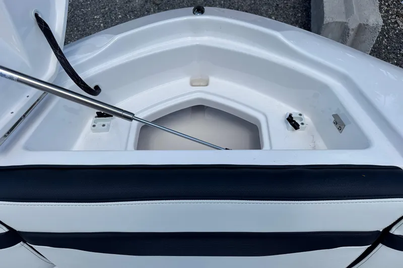 Slide: The Image of Open storage compartment of 2026 Yamaha Boats 275SD, showcasing interior design and functionality. - 27