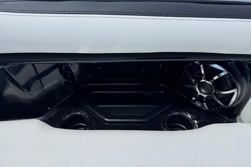 Slide: The Image of 2026 Yamaha Boats 275SD interior speaker and cup holders detail. - 29
