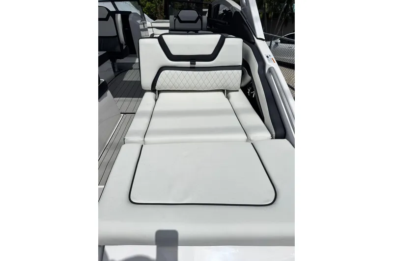 Slide: The Image of 2026 Yamaha Boats 275SD interior with luxurious white seating and modern design. - 6