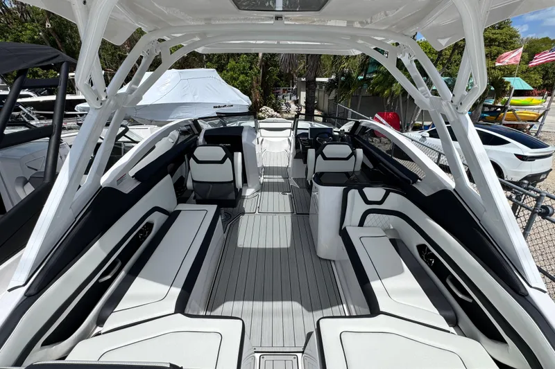 Slide: The Image of 2026 Yamaha Boats 275SD interior, showcasing sleek seating and modern design features. - 7