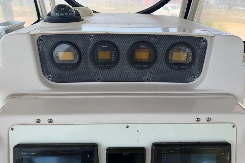 Slide: The Image of Dashboard of a 2004 Grady-White Advance 257 boat with Yamaha gauges and Garmin GPS. - 18