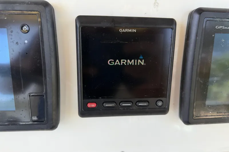 Slide: The Image of Garmin marine electronics on 2004 Grady-White Advance 257 boat dashboard. - 22