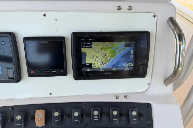 Slide: The Image of Garmin GPS system on 2004 Grady-White Advance 257 boat dashboard. - 23