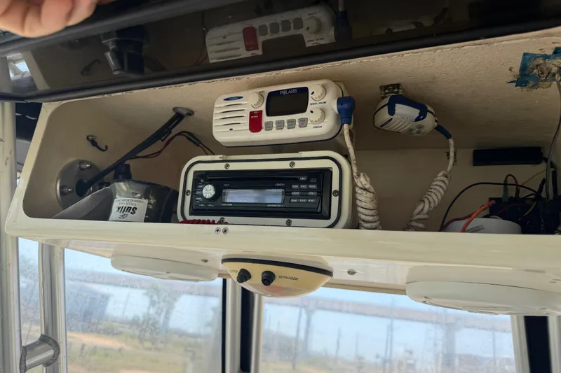 Slide: The Image of 2004 Grady-White Advance 257 boat electronics, featuring radio and communication equipment. - 27