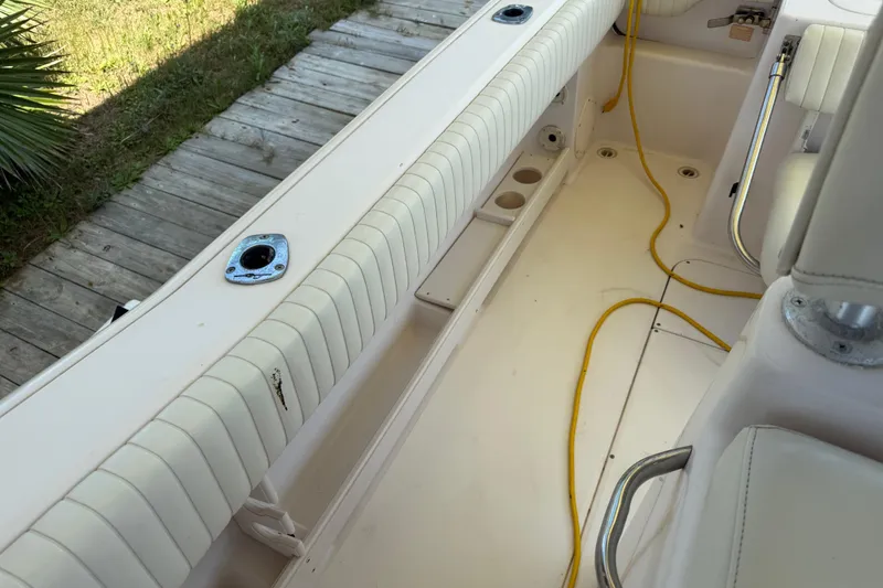 Slide: The Image of 2004 Grady-White Advance 257 boat interior with cushioned seating and yellow cord. - 29