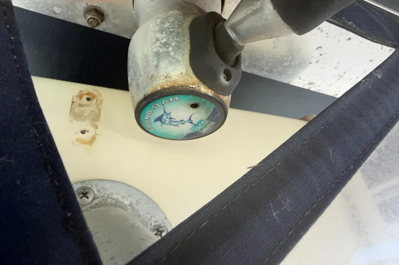 Slide: The Image of Close-up of a 2004 Grady-White Advance 257 boat component with "Grand Slam" logo. - 31