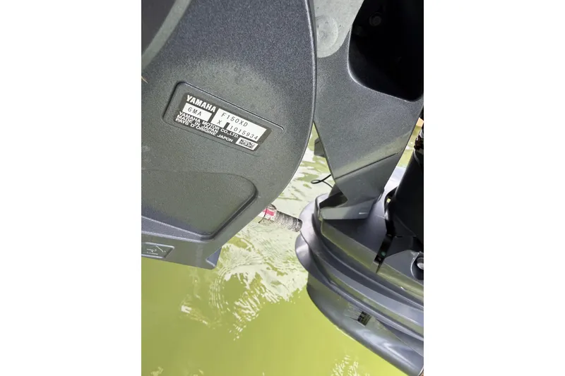 Slide: The Image of Yamaha F150TXR outboard motor on 2004 Grady-White Advance 257 boat. - 32