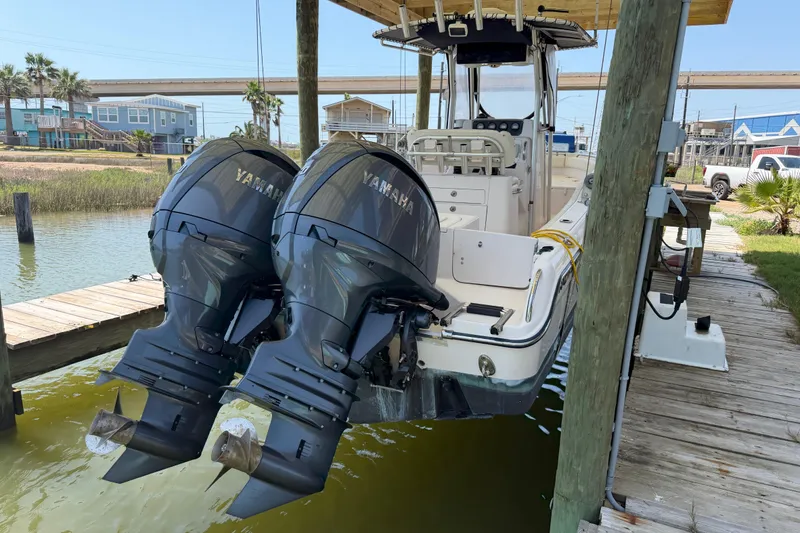 Slide: The Image of 2004 Grady-White Advance 257 boat with twin Yamaha outboard motors docked. - 8
