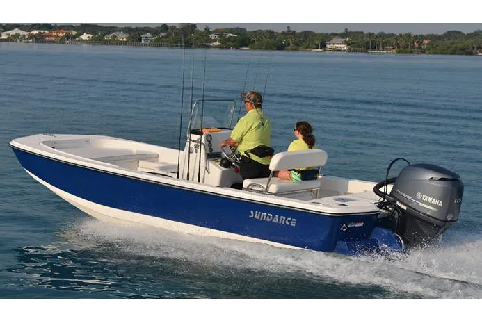 The Image of Manufacturer Provided Image: 2025 Sundance DX20 boat cruising on calm water with two passengers. - 0