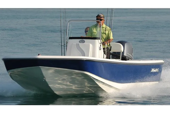 Slide: The Image of Manufacturer Provided Image: 2025 Sundance DX20 boat cruising on water, featuring a sleek blue and white design. - 4