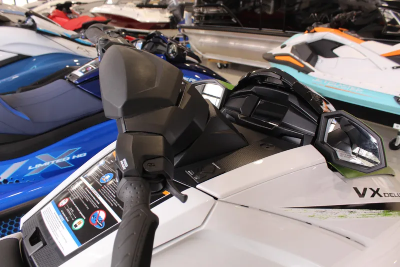 Slide: The Image of 2026 Yamaha WaveRunner VX Deluxe jet ski, close-up of handlebars and dashboard. - 2