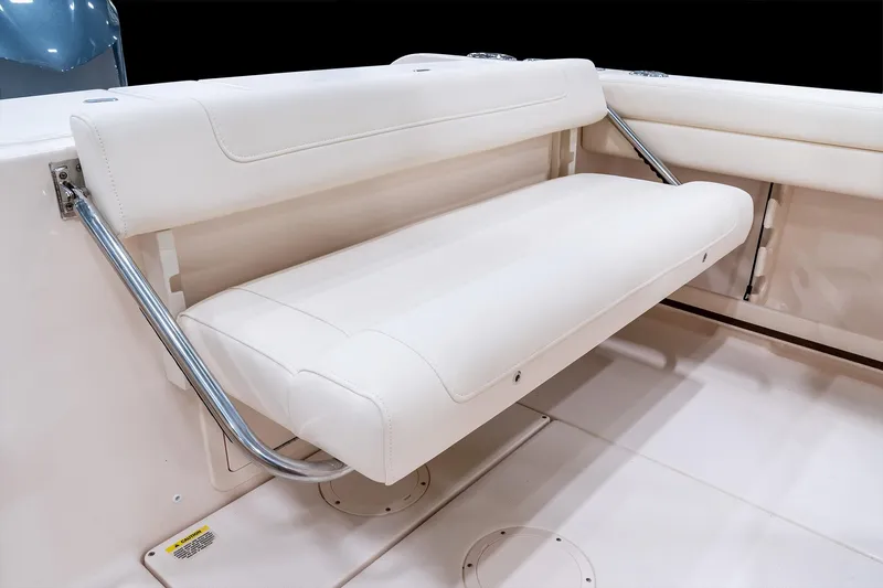 Slide: The Image of 2026 Grady-White Fisherman 236 boat seat with white upholstery and metal supports. - 6