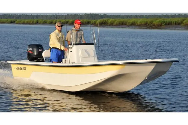 The Image of Manufacturer Provided Image: 2025 Sundance B20CCR boat cruising on a calm river with two passengers. - 0