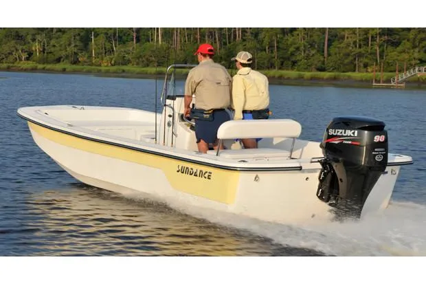 Slide: The Image of Manufacturer Provided Image: 2025 Sundance B20CCR boat with Suzuki engine on a calm lake. - 5