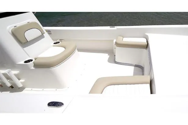 Slide: The Image of Manufacturer Provided Image: Interior seating of 2025 Sundance B20CCR boat with beige cushions. - 6