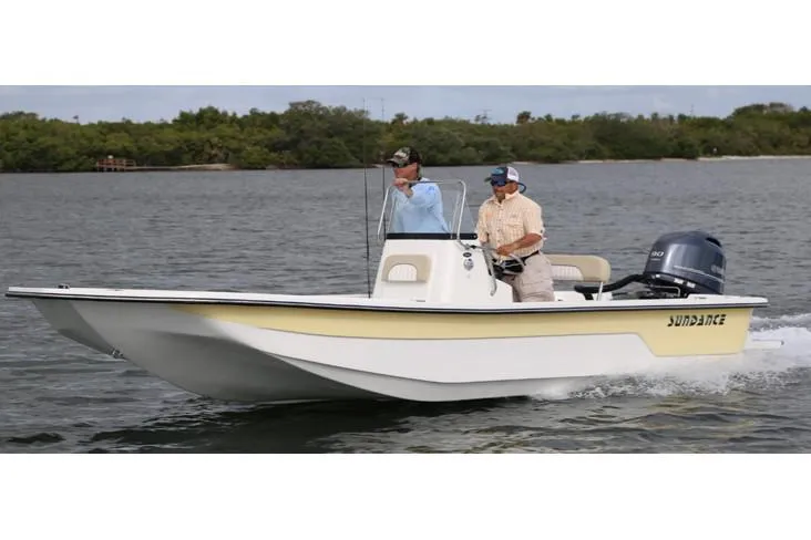 Slide: The Image of Manufacturer Provided Image: 2025 Sundance B22CCR boat cruising on a lake with two people onboard. - 3