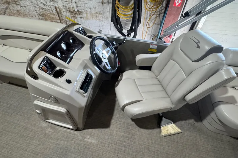 Slide: The Image of 2016 Bennington 20 SSRX boat interior with steering console and captain's chair. - 5