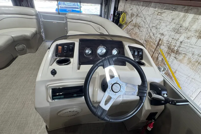 Slide: The Image of 2016 Bennington 20 SSRX boat interior with steering wheel and dashboard controls. - 8