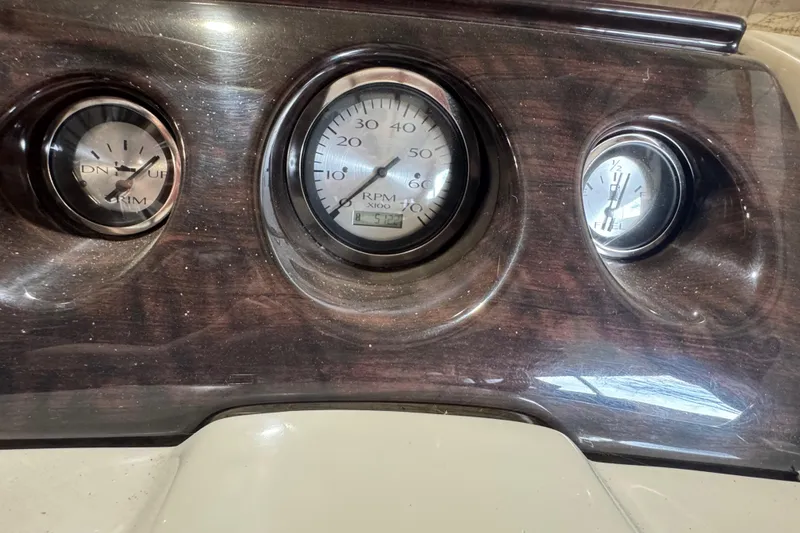 Slide: The Image of Dashboard of a 2016 Bennington 20 SSRX boat showing RPM and fuel gauges. - 9