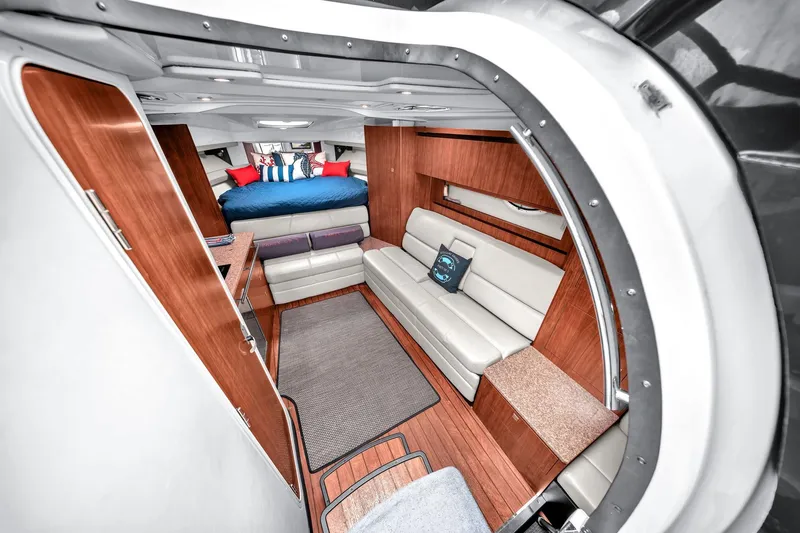 Slide: The Image of Interior of 2014 Monterey 320 Sport Yacht with modern furnishings and cozy seating area. - 27