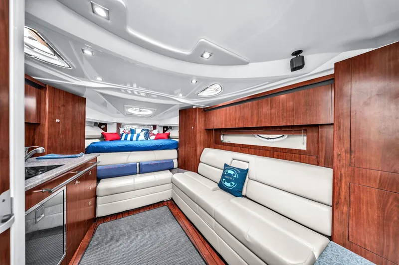 Slide: The Image of Luxurious interior of 2014 Monterey 320 Sport Yacht with modern furnishings and wood accents. - 28