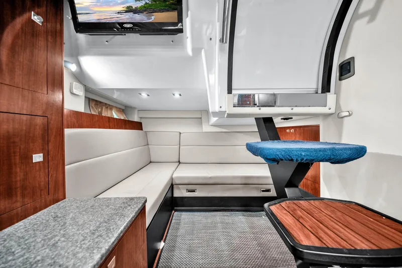 Slide: The Image of Luxurious interior of 2014 Monterey 320 Sport Yacht with modern seating and entertainment system. - 31