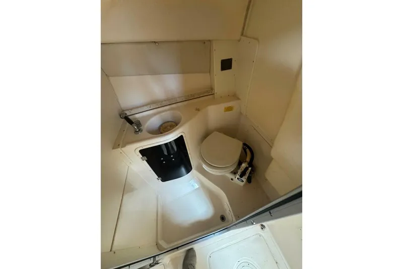 Slide: The Image of 2001 Grady-White Express 265 boat bathroom with toilet and sink. - 8