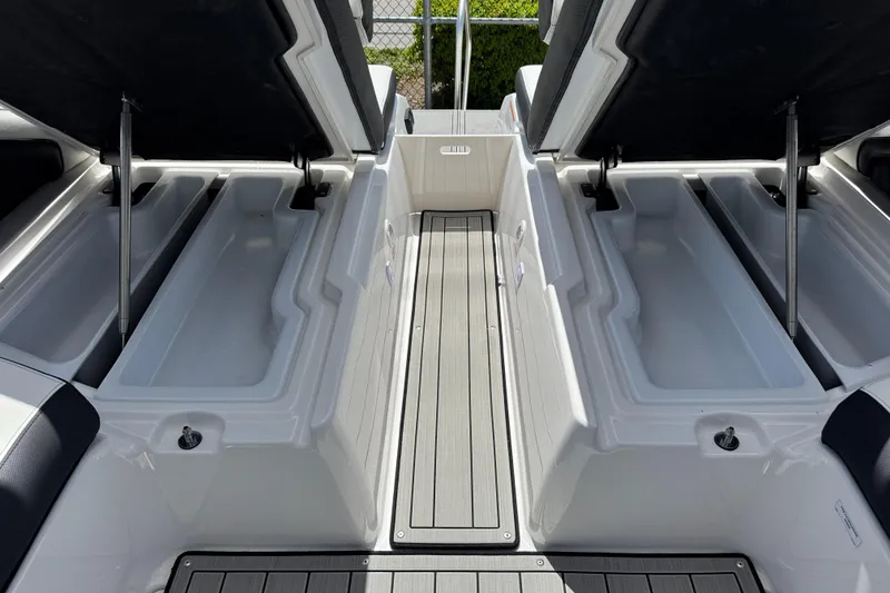 Slide: The Image of Open storage compartments on 2026 Yamaha Boats 275SD, showcasing spacious interior design. - 33