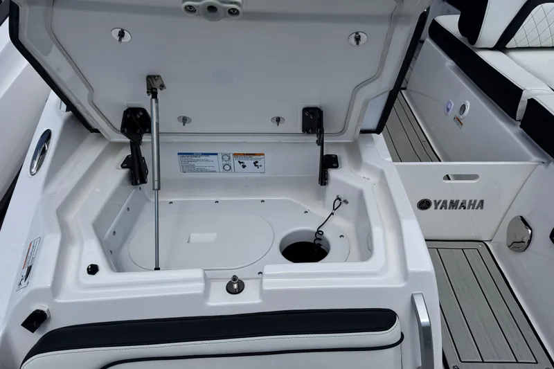 Slide: The Image of Open storage compartment on 2026 Yamaha Boats 275SD, showcasing interior features and design. - 4