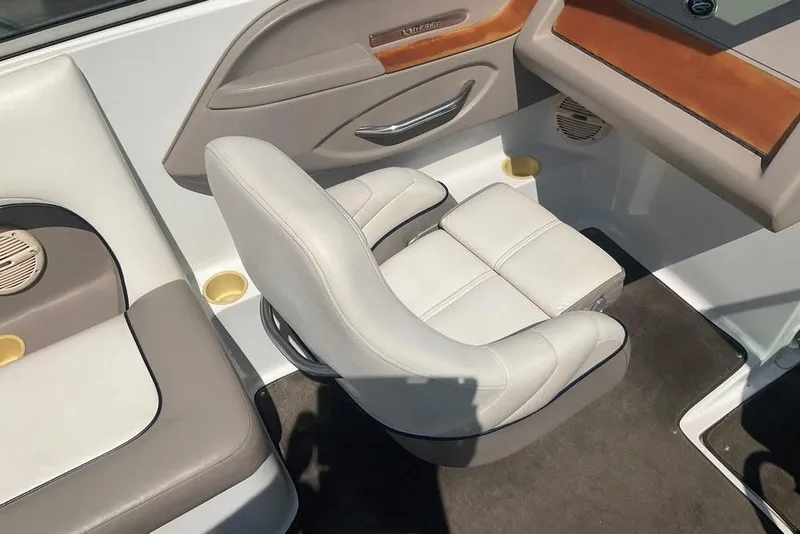 Slide: The Image of Interior of a 2000 Cobalt 226 boat featuring white and gray seating. - 11