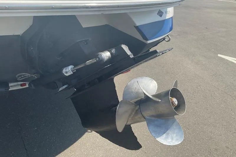 Slide: The Image of Rear view of a 2000 Cobalt 226 boat showing its propeller and stern drive. - 15