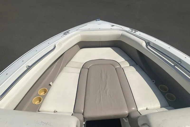 Slide: The Image of Bow seating area of a 2000 Cobalt 226 boat with cushioned seats. - 19