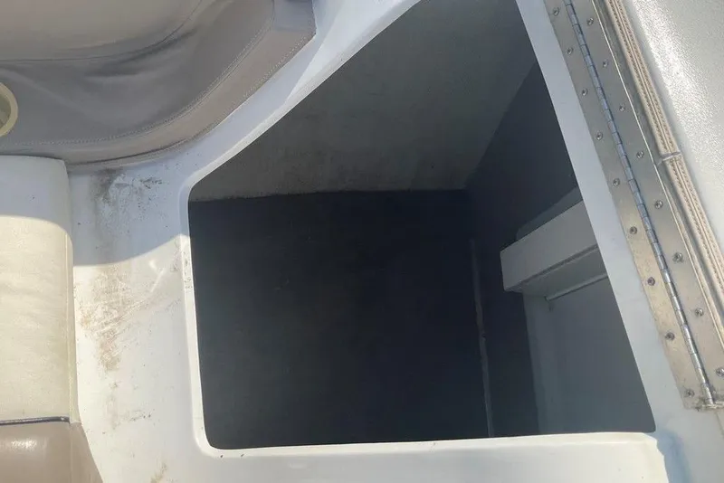 Slide: The Image of Storage compartment in a 2000 Cobalt 226 boat, featuring clean interior space. - 21