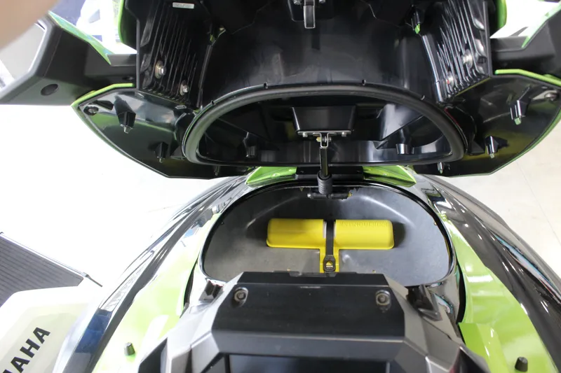 Slide: The Image of 2024 Yamaha WaveRunner FX Cruiser SVHO storage compartment open, showcasing interior design. - 6