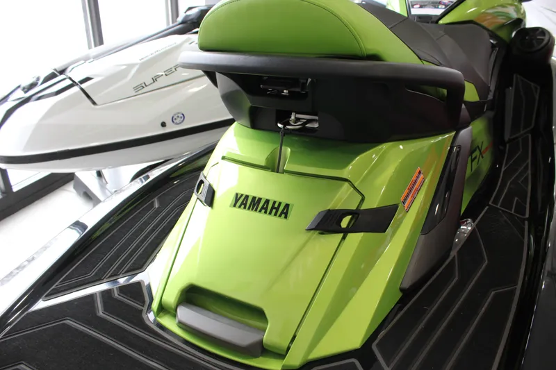 Slide: The Image of 2024 Yamaha WaveRunner FX Cruiser SVHO in vibrant green, showcased indoors. - 7