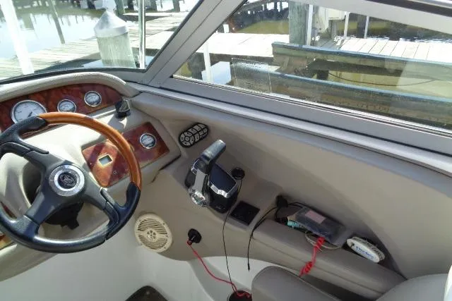 Slide: The Image of Interior view of a 2006 Cobalt 282 boat cockpit with steering wheel and controls. - 14