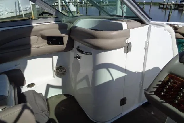 Slide: The Image of Interior of a 2006 Cobalt 282 boat, featuring seating and control panel. - 17