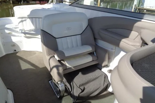 Slide: The Image of 2006 Cobalt 282 boat interior with cushioned seating and sleek design. - 19