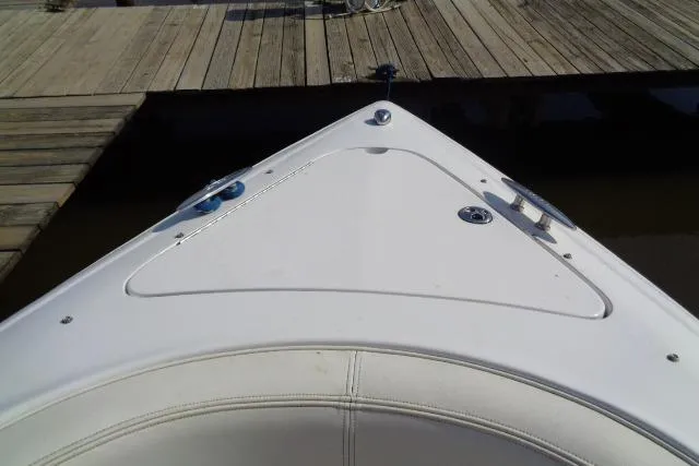 Slide: The Image of Bow of a 2006 Cobalt 282 boat docked at a wooden pier. - 2
