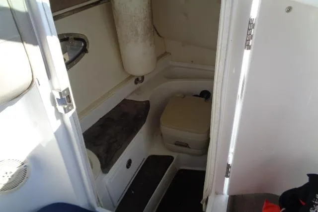 Slide: The Image of Interior cabin of a 2006 Cobalt 282 boat with seating and storage. - 20
