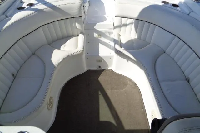 Slide: The Image of 2006 Cobalt 282 boat interior with white cushioned seating. - 23