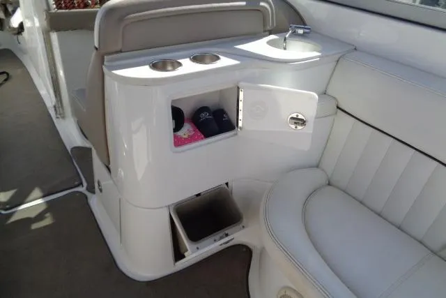 Slide: The Image of Interior of a 2006 Cobalt 282 boat with seating and storage compartments. - 25