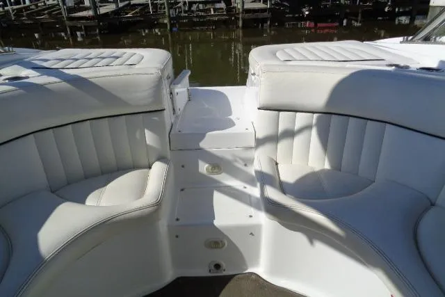 Slide: The Image of 2006 Cobalt 282 boat interior with white cushioned seating and step access. - 30
