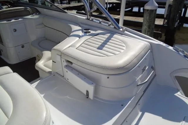 Slide: The Image of 2006 Cobalt 282 boat interior with white leather seating and sleek design. - 33