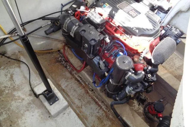 Slide: The Image of Engine compartment of a 2006 Cobalt 282 boat, featuring a well-maintained motor. - 38